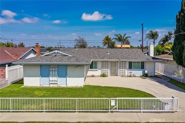 single story home with driveway, a chimney, a fenced front yard, a front lawn, and a shingled roof