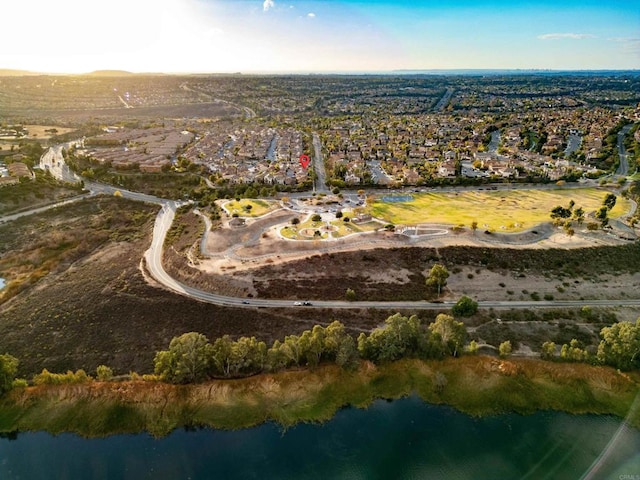 aerial view with a water view and a residential view