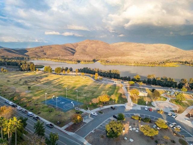 drone / aerial view with a water and mountain view