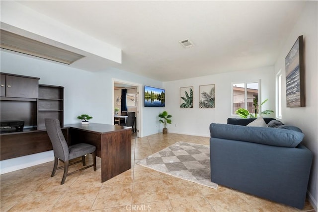 home office with light tile patterned flooring and visible vents