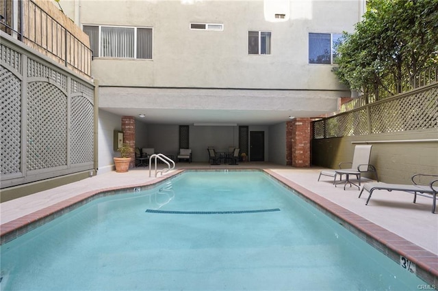 pool with a patio area
