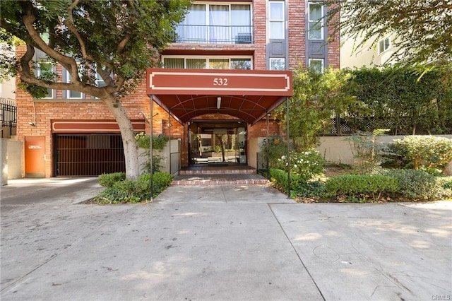 entrance to property with brick siding