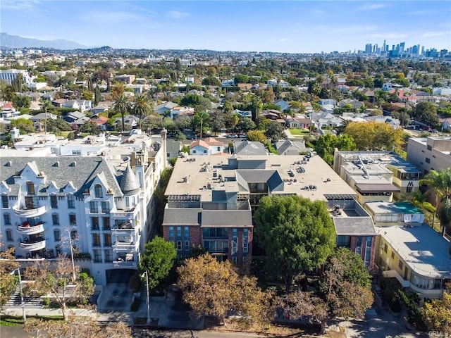 drone / aerial view featuring a residential view and a mountain view