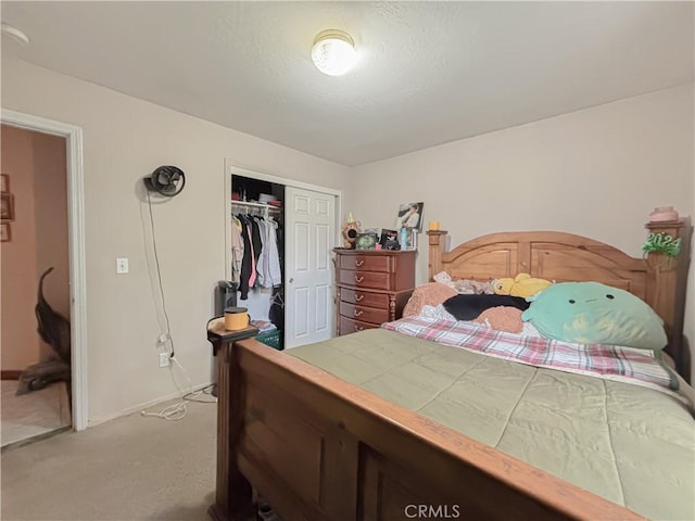 2901 Flint Hills Dr, Bakersfield, CA 93313 - bedroom featuring a closet, baseboards, and light colored carpet