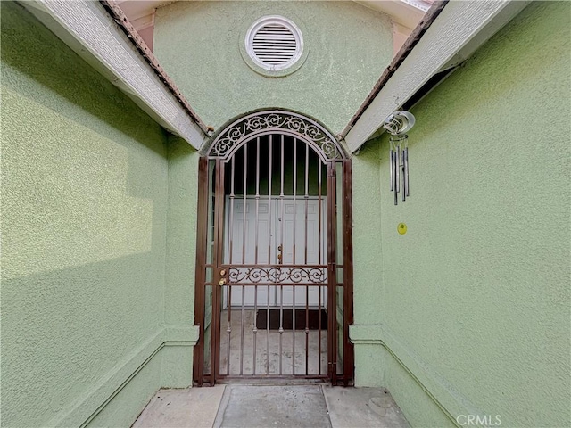 2901 Flint Hills Dr, Bakersfield, CA 93313 - doorway to property featuring a gate and stucco siding