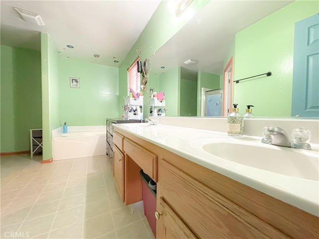 2901 Flint Hills Dr, Bakersfield, CA 93313 - bathroom featuring double vanity, a garden tub, visible vents, a stall shower, and a sink