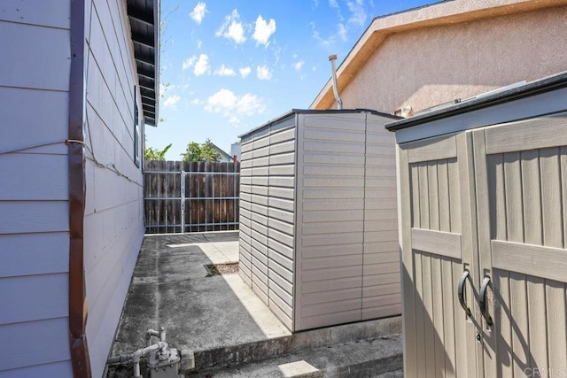 view of outbuilding with fence
