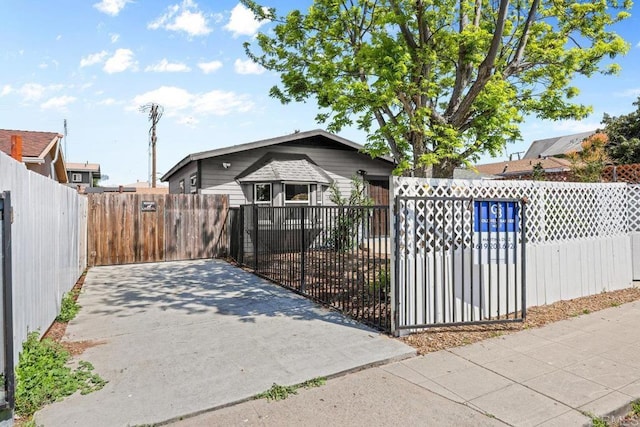 view of front of house featuring a fenced front yard and a gate
