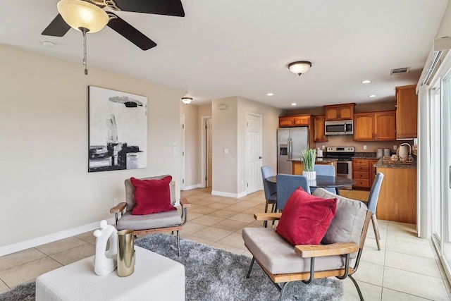 living room with visible vents, baseboards, recessed lighting, a ceiling fan, and light tile patterned floors