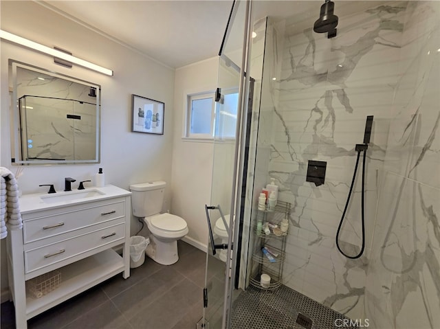 bathroom with toilet, vanity, a marble finish shower, tile patterned floors, and crown molding