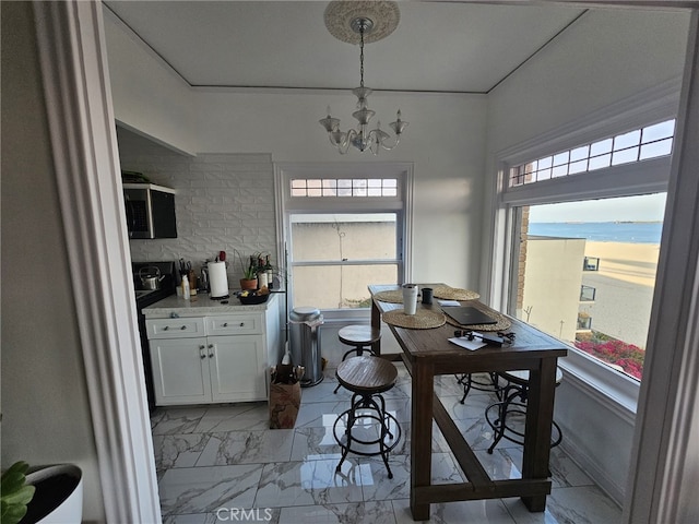 1030 E Ocean Blvd Unit 210, Long Beach, CA 90802 - dining space featuring marble finish flooring, a chandelier, and a desk