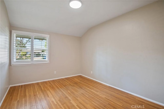 17048 Baltar St, Lake Balboa, CA 91406 - spare room featuring baseboards, light wood-style flooring, and lofted ceiling