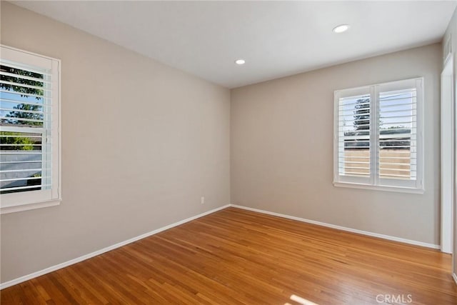 17048 Baltar St, Lake Balboa, CA 91406 - spare room with baseboards, recessed lighting, and wood finished floors