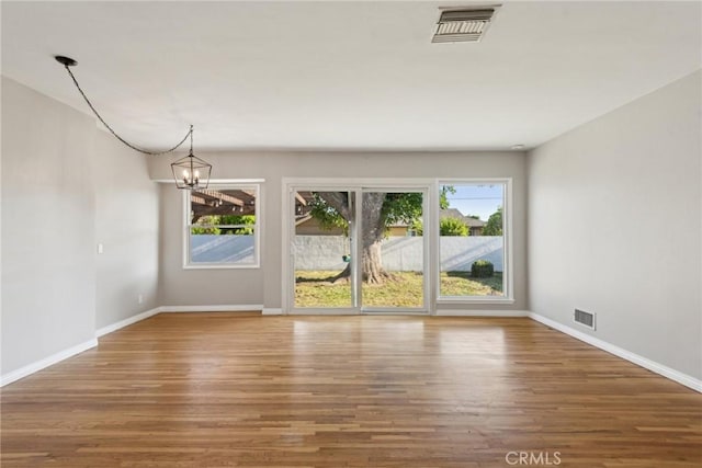 17048 Baltar St, Lake Balboa, CA 91406 - interior space with plenty of natural light, wood finished floors, and visible vents
