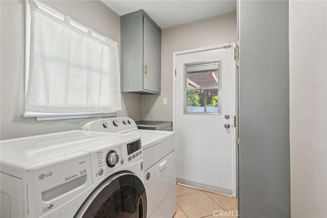 17048 Baltar St, Lake Balboa, CA 91406 - washroom with washing machine and clothes dryer, light tile patterned floors, and cabinet space