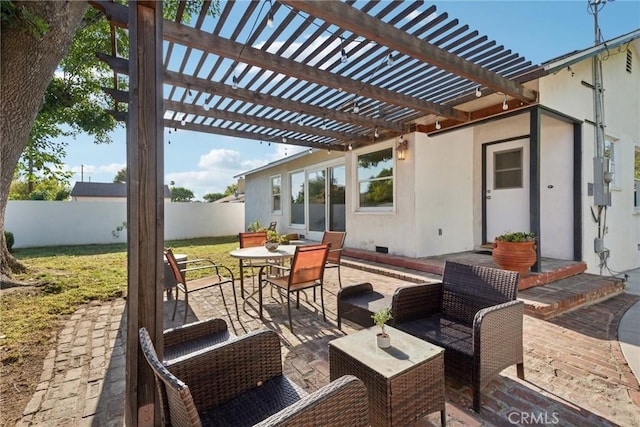view of patio featuring a fenced backyard, outdoor lounge area, a pergola, and outdoor dining space