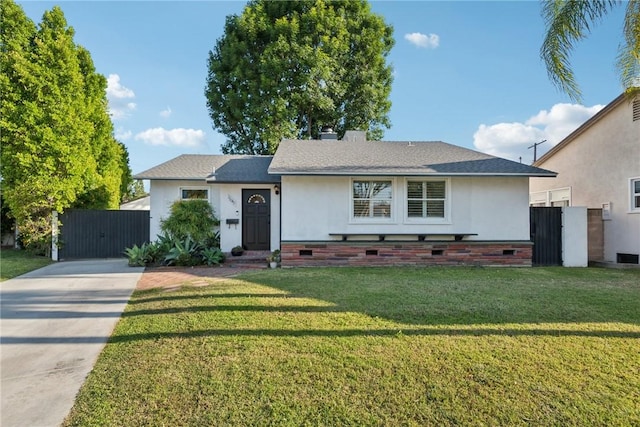 ranch-style home featuring a front lawn, stucco siding, driveway, and crawl space