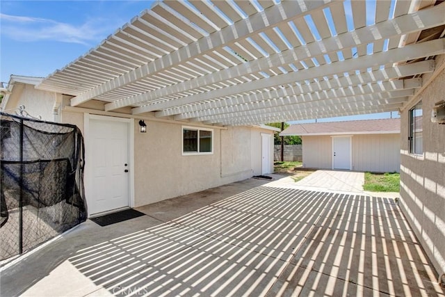 view of patio featuring fence and a pergola