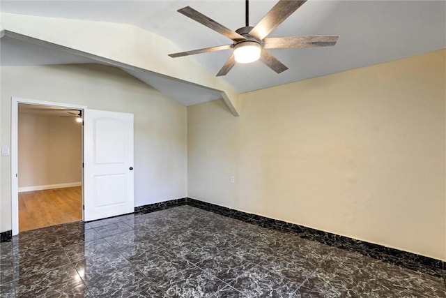 spare room featuring ceiling fan, vaulted ceiling, baseboards, and marble finish floor