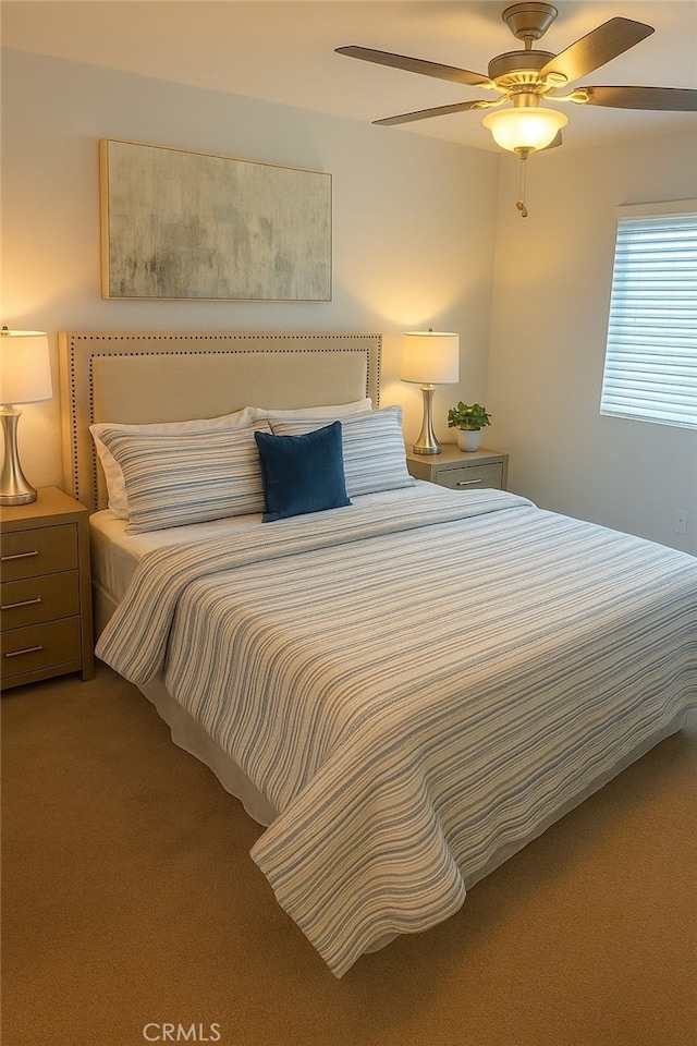 bedroom with carpet floors and a ceiling fan