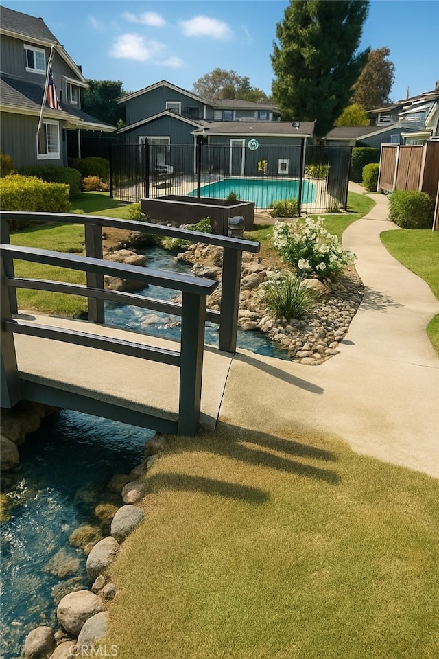 view of property's community with fence