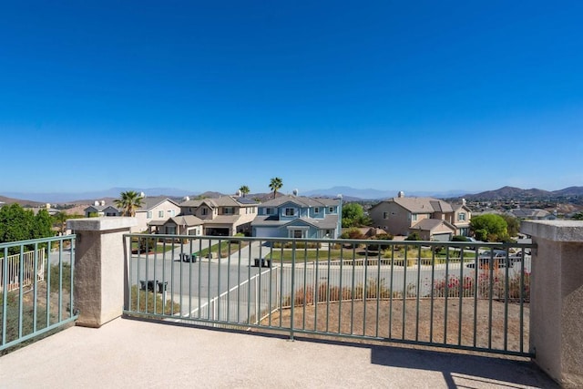 exterior space with a residential view and a mountain view