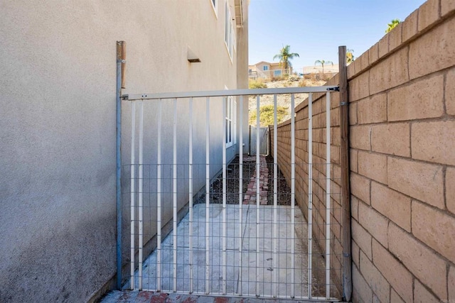 view of gate with fence