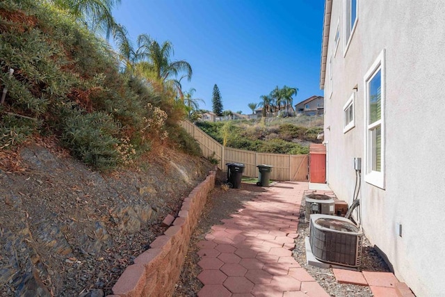 view of patio / terrace with a fenced backyard and central AC