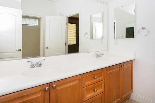 bathroom featuring double vanity and a sink