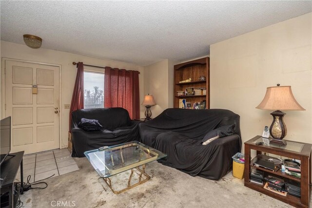living room with a textured ceiling