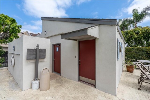 view of front of property featuring stucco siding and a patio