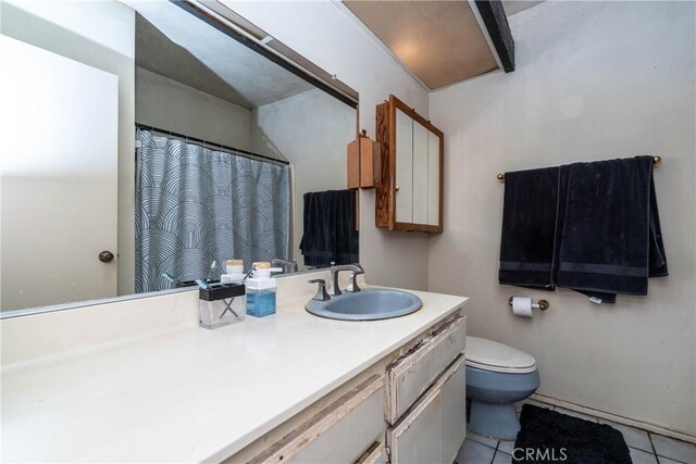 bathroom with toilet, tile patterned flooring, vanity, and a shower with curtain
