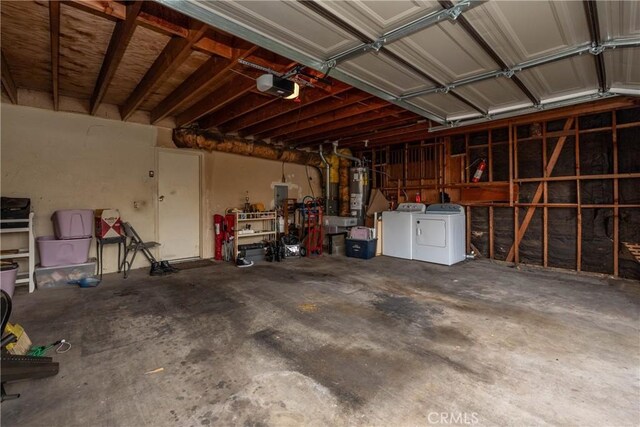 garage featuring washer and dryer and a garage door opener
