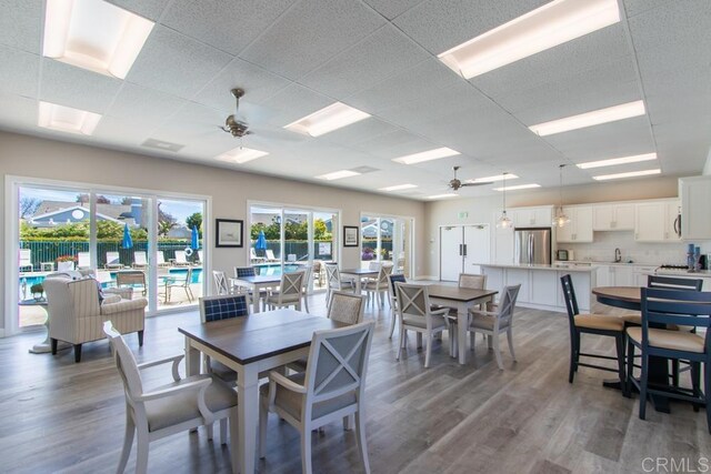 814 Okra Ct, Carlsbad, CA 92011 - dining space with ceiling fan, wood finished floors, and a paneled ceiling