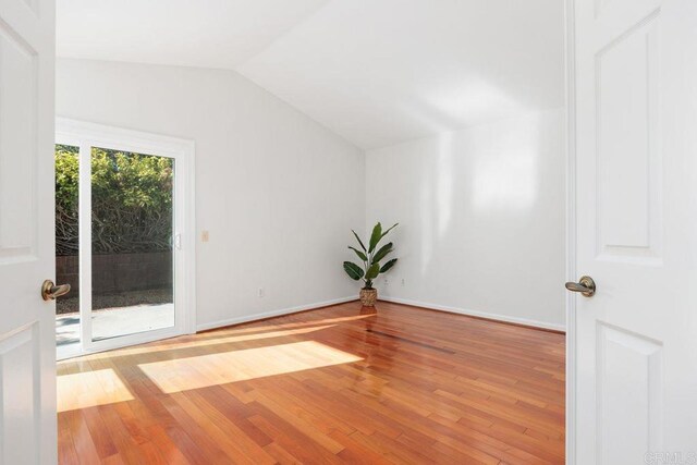 814 Okra Ct, Carlsbad, CA 92011 - empty room featuring lofted ceiling and wood finished floors