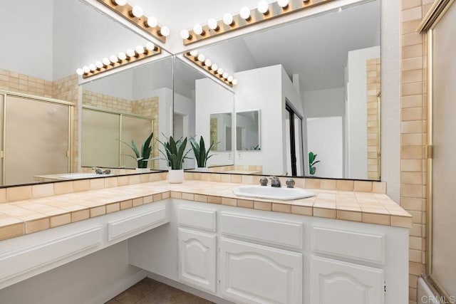 814 Okra Ct, Carlsbad, CA 92011 - full bath with double vanity, a tile shower, and tile patterned flooring