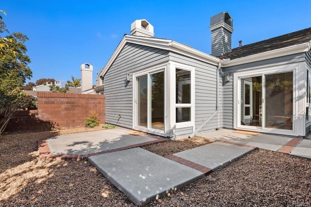 814 Okra Ct, Carlsbad, CA 92011 - rear view of property featuring a patio and a chimney