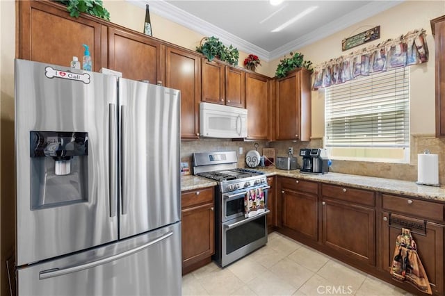 5551 Corte Fiesta, Hemet, CA 92545 - kitchen with appliances with stainless steel finishes, decorative backsplash, ornamental molding, light stone counters, and brown cabinetry