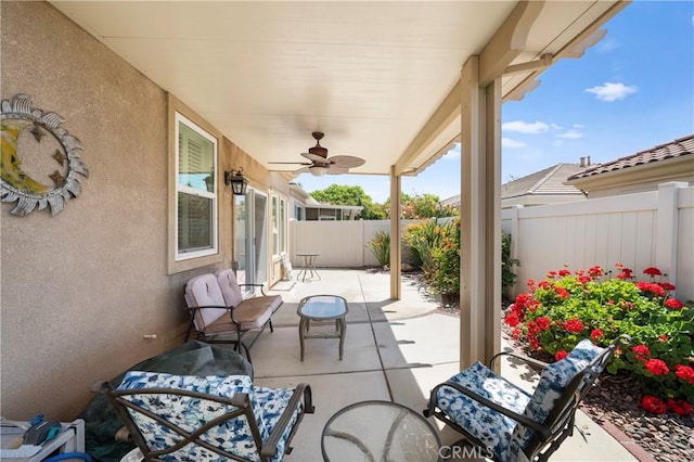 5551 Corte Fiesta, Hemet, CA 92545 - fenced backyard with a ceiling fan and a patio