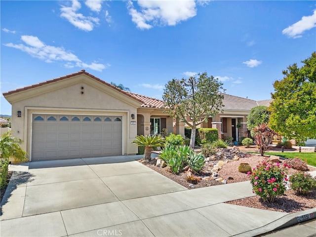 5551 Corte Fiesta, Hemet, CA 92545 - view of front of house featuring driveway, stucco siding, a garage, and a tiled roof