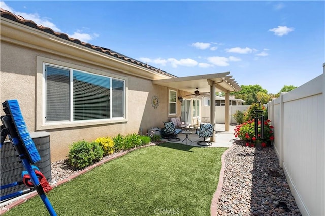 5551 Corte Fiesta, Hemet, CA 92545 - fenced backyard featuring a ceiling fan and a patio area