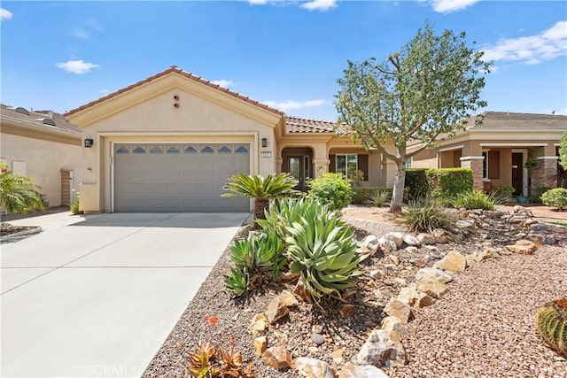 5551 Corte Fiesta, Hemet, CA 92545 - view of front of home featuring stucco siding, driveway, an attached garage, and a tiled roof