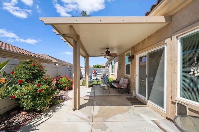 5551 Corte Fiesta, Hemet, CA 92545 - fenced backyard with a patio area and a ceiling fan
