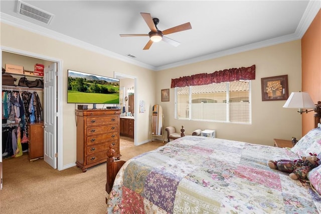 5551 Corte Fiesta, Hemet, CA 92545 - bedroom featuring crown molding, light colored carpet, a spacious closet, a closet, and connected bathroom