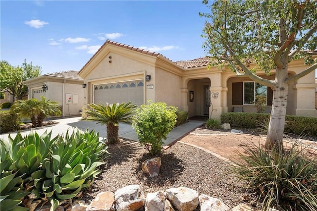 5551 Corte Fiesta, Hemet, CA 92545 - mediterranean / spanish-style home with a garage, stucco siding, a tile roof, and concrete driveway