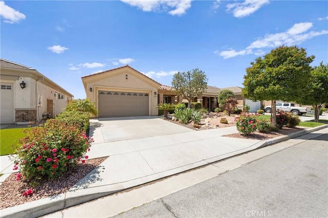 5551 Corte Fiesta, Hemet, CA 92545 - view of front of property featuring an attached garage, concrete driveway, and stucco siding
