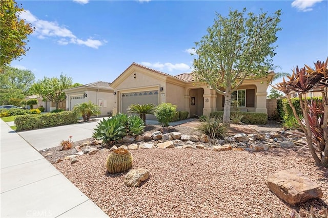 5551 Corte Fiesta, Hemet, CA 92545 - mediterranean / spanish home with an attached garage, concrete driveway, stucco siding, and a tiled roof