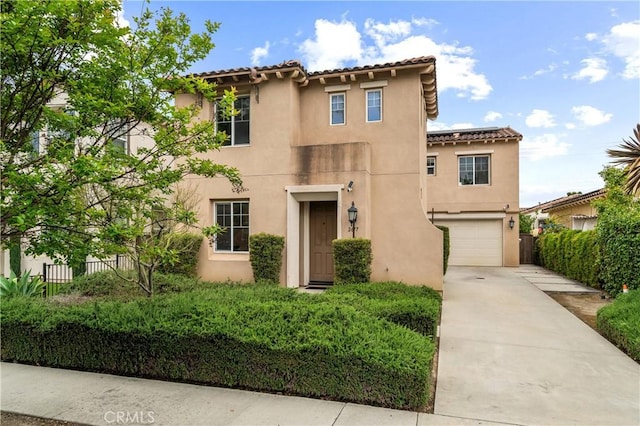 2677 E Tyler St, Long Beach, CA 90810 - mediterranean / spanish home with fence, a tile roof, a garage, stucco siding, and concrete driveway