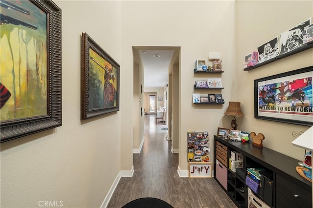 2677 E Tyler St, Long Beach, CA 90810 - hallway featuring dark wood-type flooring and baseboards