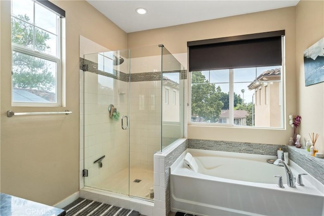 2677 E Tyler St, Long Beach, CA 90810 - bathroom featuring a garden tub, recessed lighting, and a shower stall